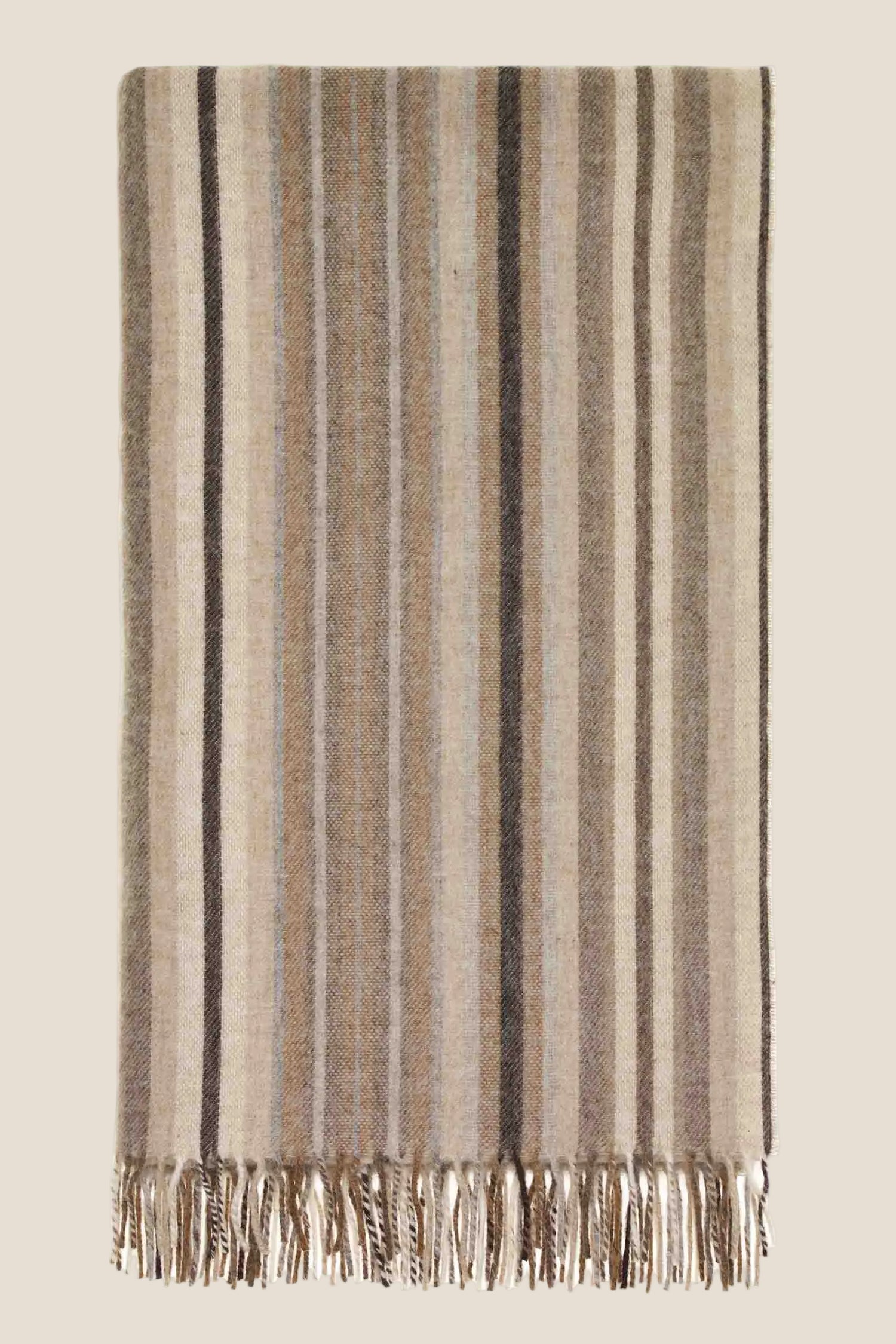Striped blanket with fringes on a white background