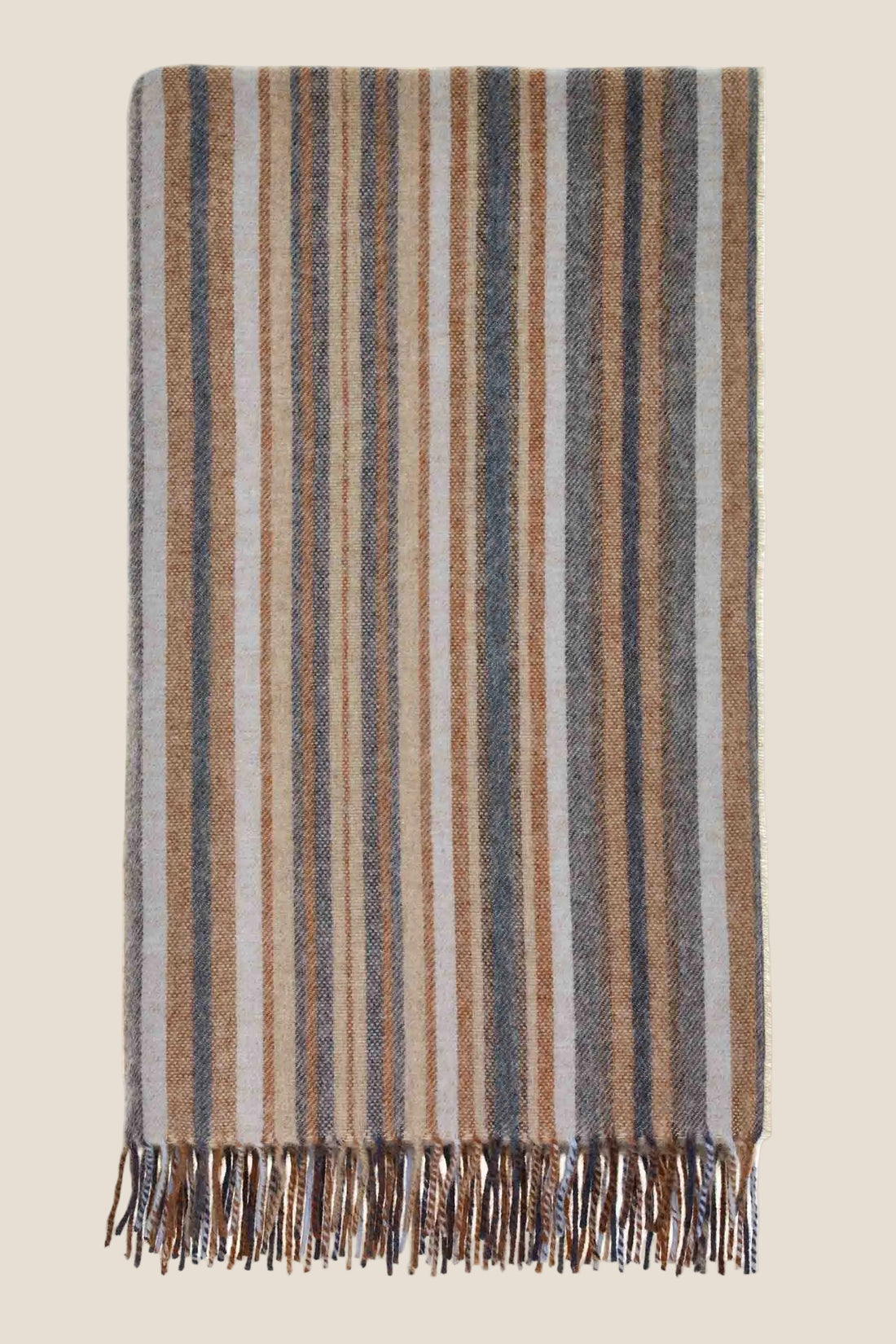 Striped blanket with fringes on a white background